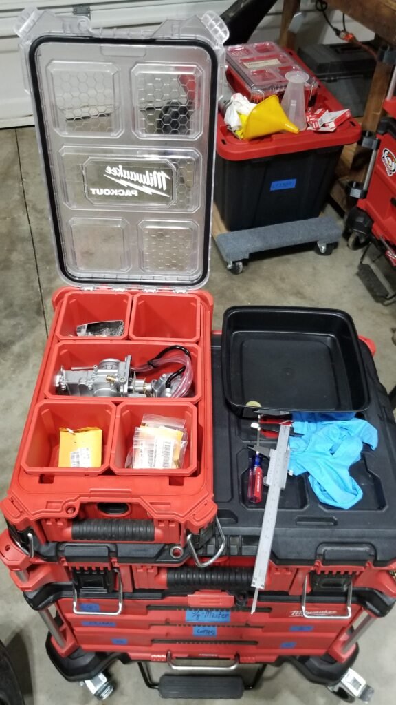 Milwaukee Packout with Mikuni TM 34 and a complete set of pilot, main, needle jets and jet needles as well as a few other handy things. 